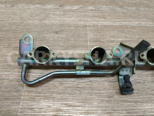 Рейка топливная (рампа) Nissan Presea оригинальный номер 166003J100