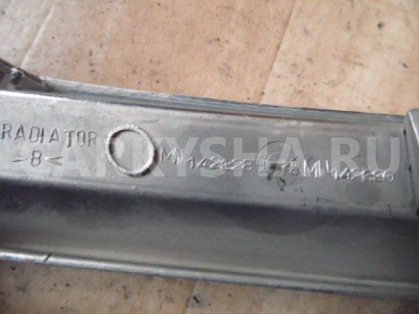 Решетка радиатора Mitsubishi L200 IV (2006—2014) Mitsubishi i оригинальный номер MN142328