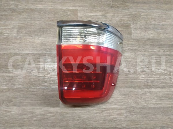 Фонарь задний наружный левый Toyota Land Cruiser оригинальный номер 8156160B70